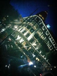 Low angle view of illuminated buildings at night