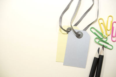 Close-up of colored pencils over white background