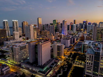 Aerial view of modern buildings in city against sky