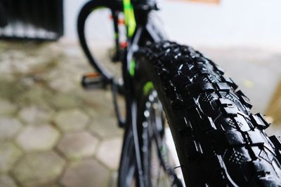 Close-up of bicycle parked on street