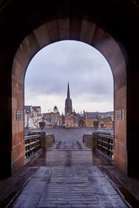 Cathedral seen through arch against sky