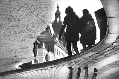 People standing by building