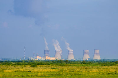 Scenic view of field against clear sky