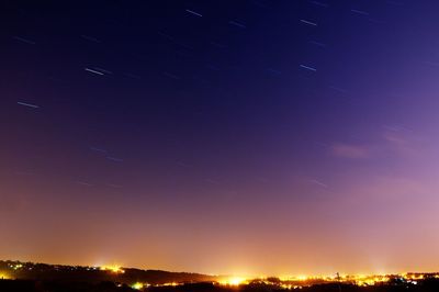 Scenic view of landscape against sky at night