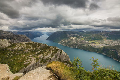 Scenic view of lake and mountains against sky