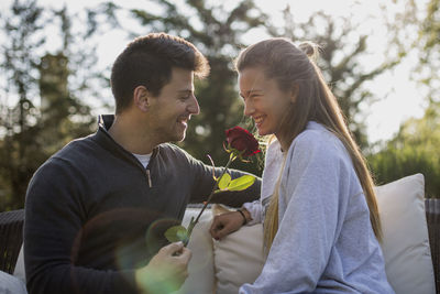 Man and woman holding outdoors