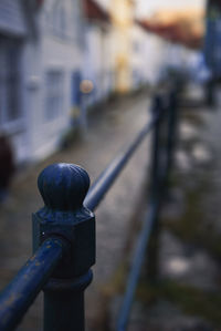 Close-up of metallic railing on footpath