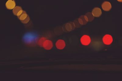 Defocused image of illuminated lights at night