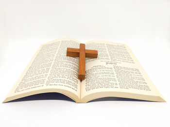 Close-up of open book against white background