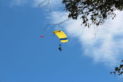 Scenic view of frozen paragliding against sky