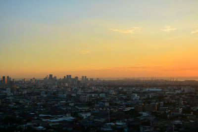 Cityscape against sky during sunset