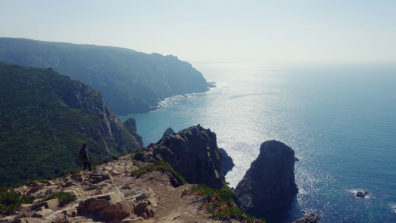 sea, water, horizon over water, tranquil scene, scenics, tranquility, beauty in nature, rock - object, nature, rock formation, sky, cliff, beach, idyllic, shore, clear sky, coastline, high angle view, rock, non-urban scene