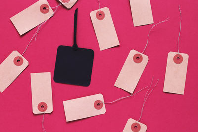Directly above view of red and paper on table