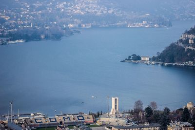 High angle view of sea and buildings in city