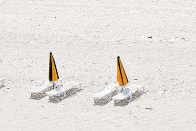 High angle view of yellow umbrella on beach