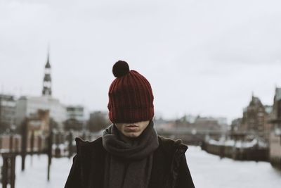 Man wearing knit hat city during winter