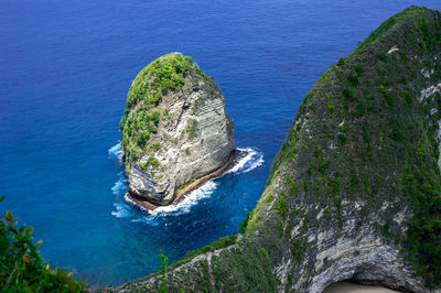 High angle view of rock on sea shore
