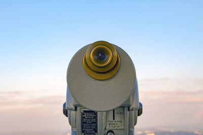 Close-up of coin-operated binoculars against clear sky