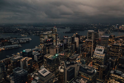 High angle view of illuminated city buildings against sky