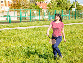 Woman playing badminton at park