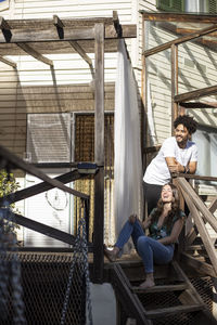 Young couple sitting on floor