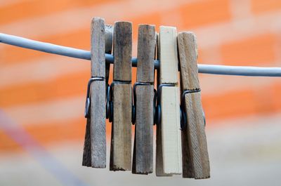 Close-up of clothespins on clothesline