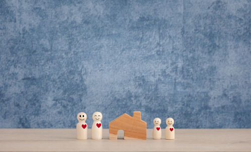 Toy car on table against blue background