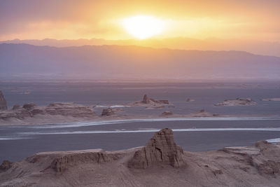 Scenic view of landscape against sky during sunset