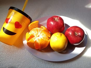 High angle view of fruits in plate on table