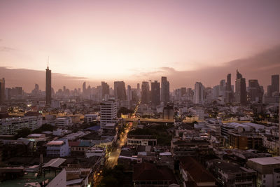 High angle view of city at sunset