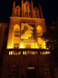 Low angle view of illuminated building at night