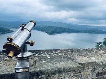 Scenic view of mountains against sky with edersee, ger in the background and telescope in the front.