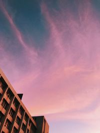 Low angle view of buildings against sky during sunset