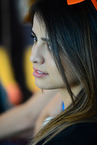 Close-up of young woman looking away