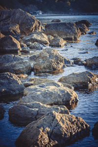 High angle view of rocks in sea