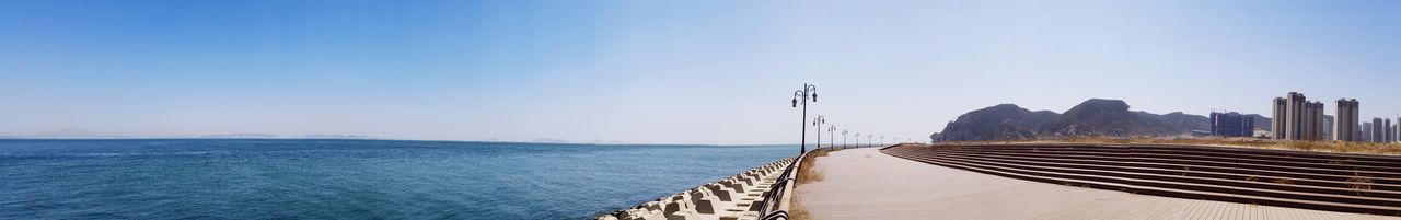 Scenic view of sea against blue sky