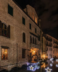 Buildings in city at night