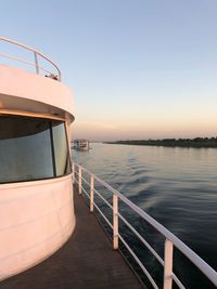 Scenic view of sea against clear sky during sunset