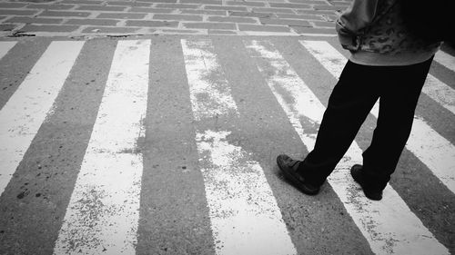 High angle view of people walking on wet road