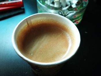 Close-up of coffee cup on table