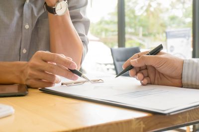 Midsection of woman working on table