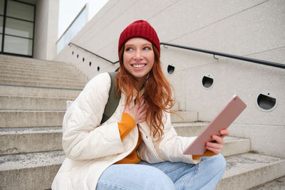 Young woman using mobile phone