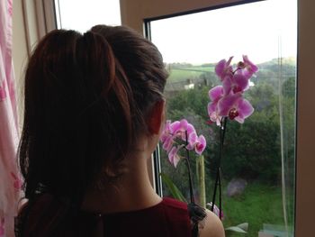 Close-up of woman holding flowers