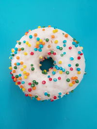Directly above shot of multi colored candies on blue background