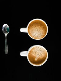 Close-up of coffee cup on black background