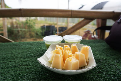 Close-up of fruits in plate on table