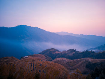 Scenic view of mountains against sky during sunset