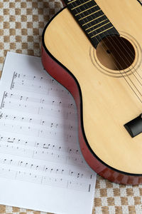 High angle view of guitar on table