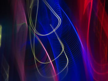 Close-up of light painting against black background