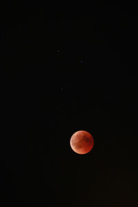 Low angle view of moon against sky at night